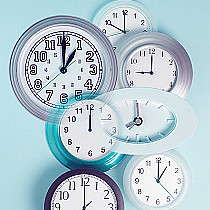 Different layered clocks on wall, close-up, George Diebold, Getty Images, Photodisc